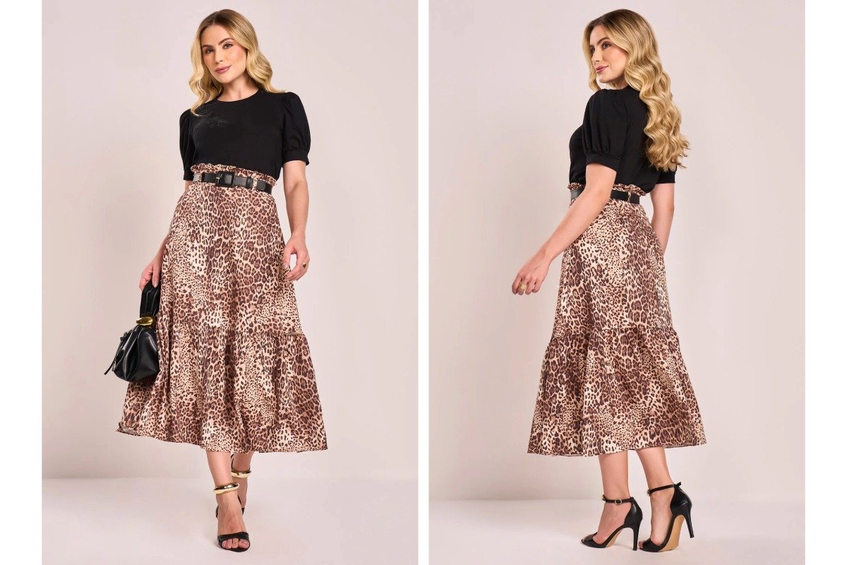 mulher usando blusa preta e saia com estampa animal print