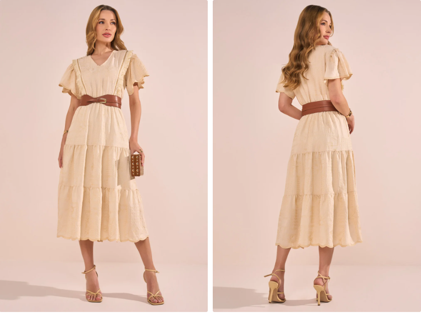 mulher usando vestido bege com bolsa de mao